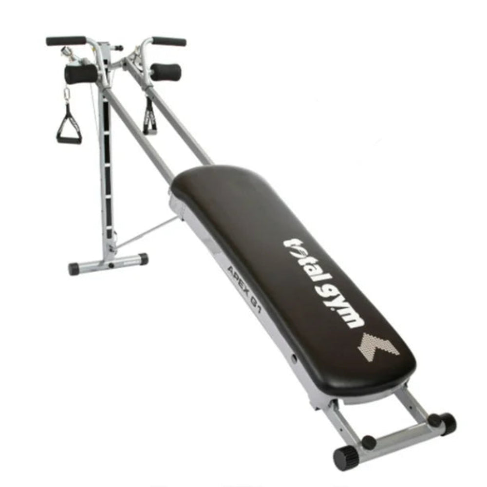 Total Gym exercise bench with attached equipment on a white background